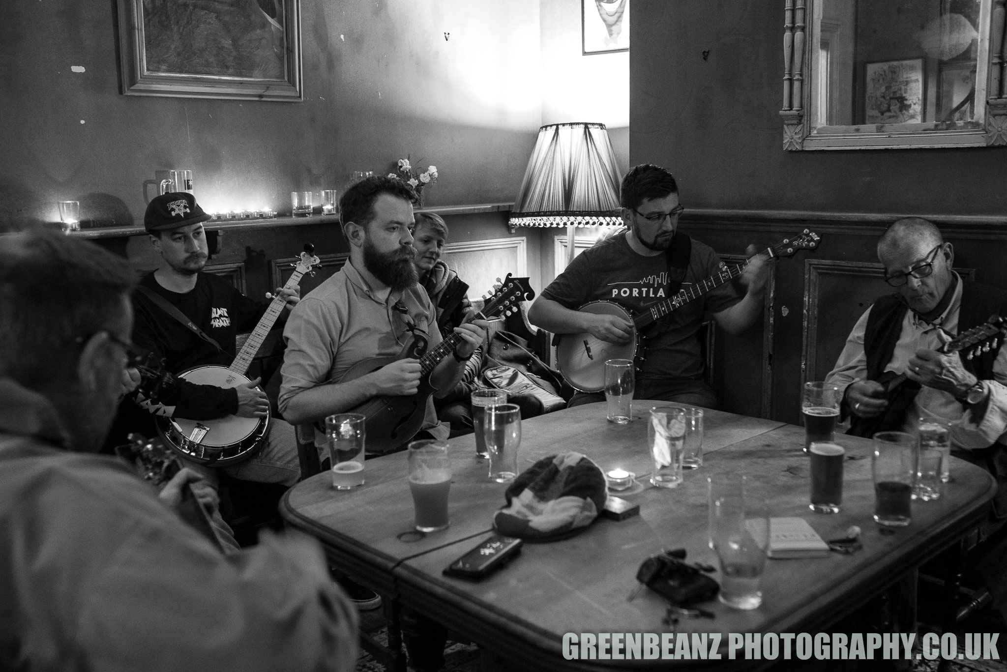 Bluegrass Jam founder Marty on Mandolin around the big table in 2019